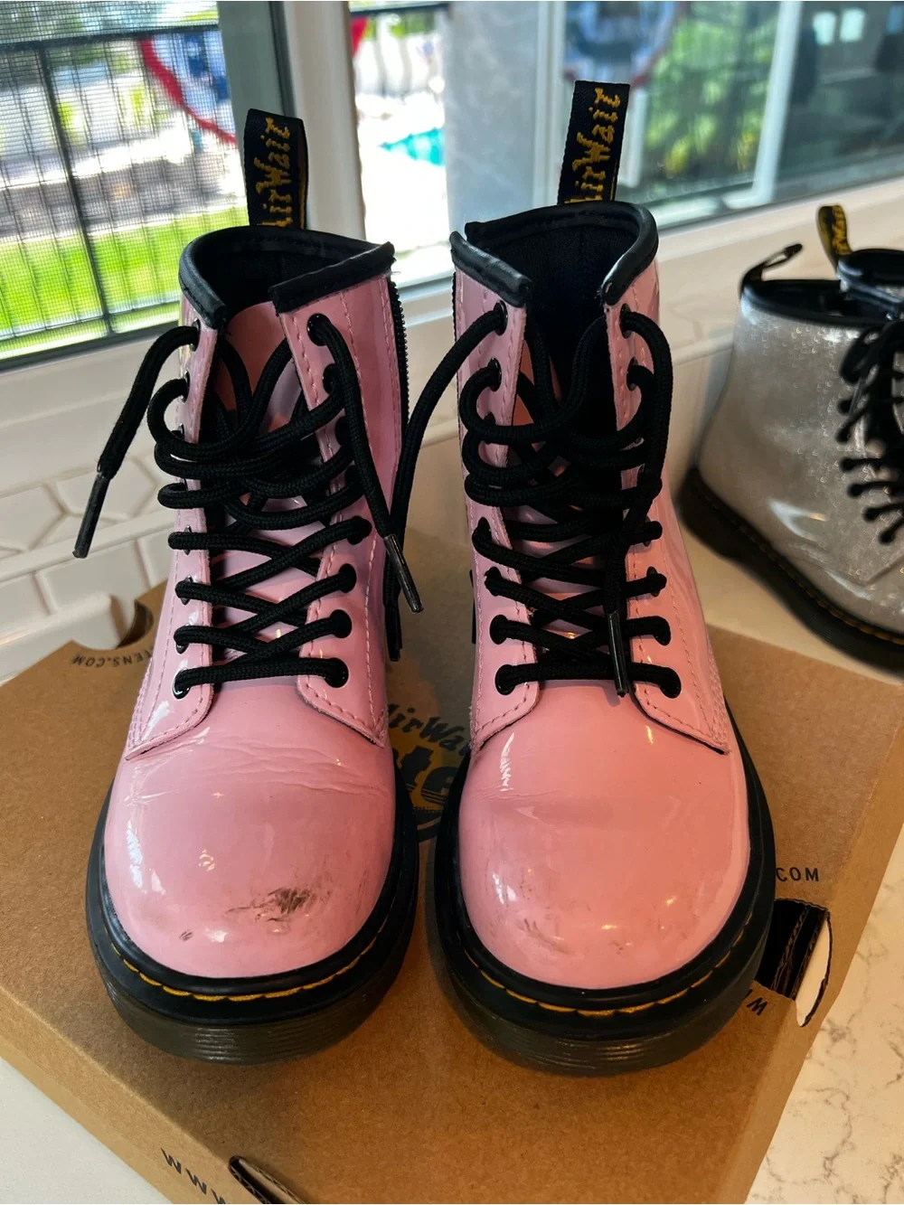 Dr. Martens Pale Pink Patent 8-Eye Lace-Up Boots with Black Accents